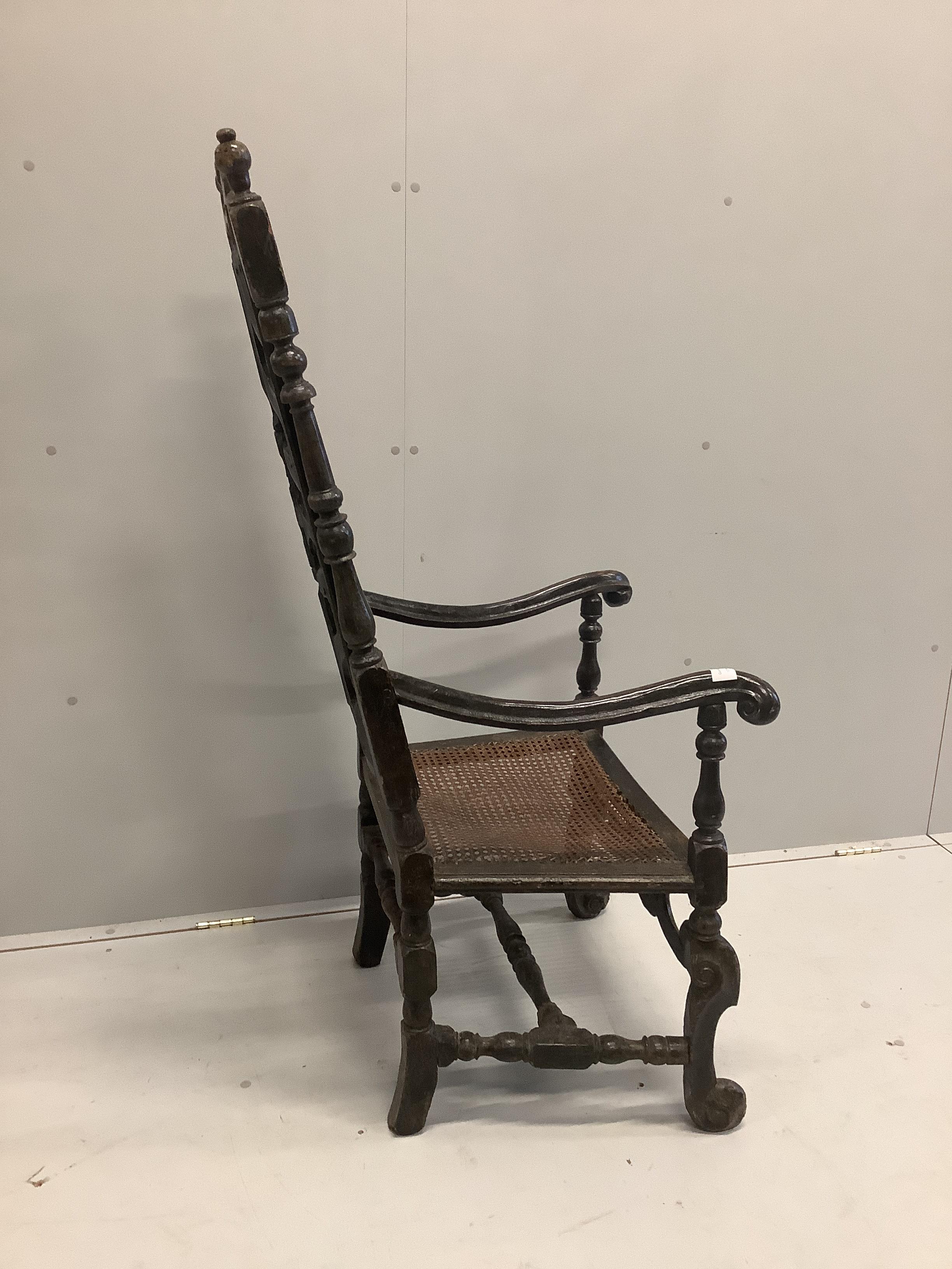 A 17th century and later walnut cane seat high back elbow chair, width 62cm, depth 53cm, height 134cm